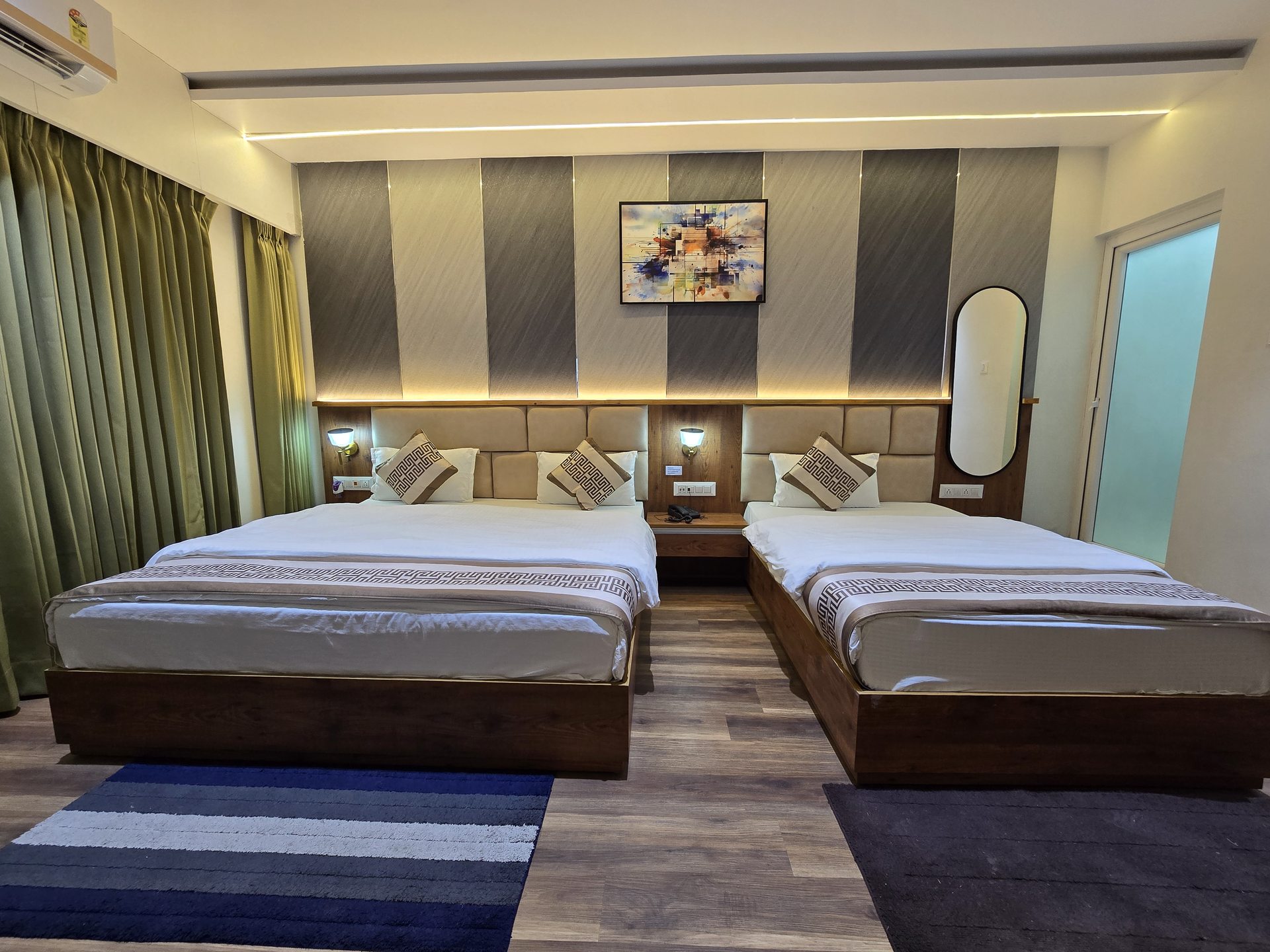 Executive Triple Bed Room front view showing double and single bed setup