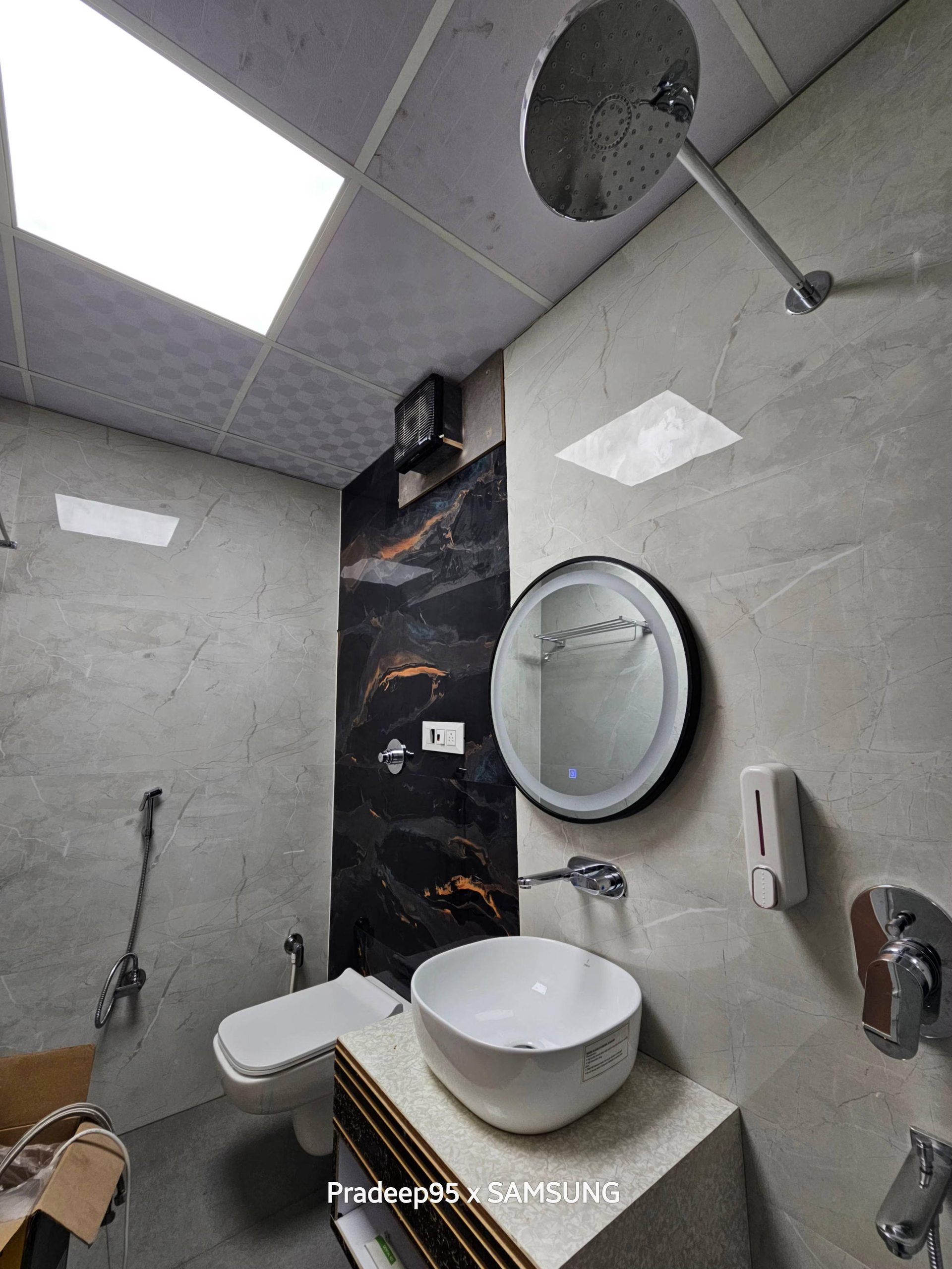Modern luxury bathroom with circular illuminated LED mirror at Hotel Fortune, Ayodhya